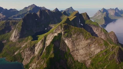 An aerial perspective captures the spellbinding beauty of mountains and fjords Stock Footage 250182400