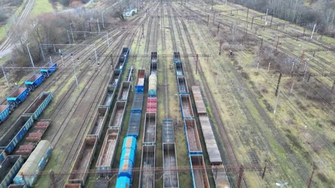 Aerial perspective captures a sprawling freight train yard filled with various Stockbeeldmateriaal 347790499