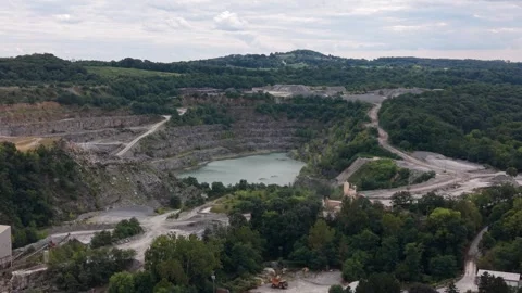 An aerial perspective capturing an expansive limestone quarry pit featuring Stockbeeldmateriaal 345046739