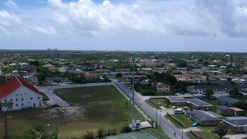 Aerial Perspective of Cell Tower Among Residential Homes in the Bahamas Stock Footage 90105671