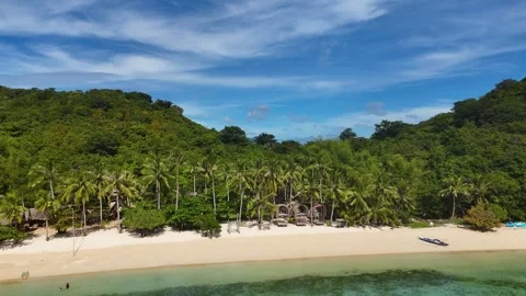 Aerial perspective of Coco Beach, showcasing its tranquil beauty and vibrant Stock Footage 295913556