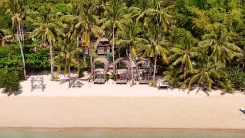 Aerial perspective of Coco Beach, showcasing its tranquil beauty and vibrant Stock Footage 295913934