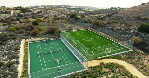 Aerial Perspective of Courts Surrounded by Breathtaking Mountain Views Stock Footage 268741035