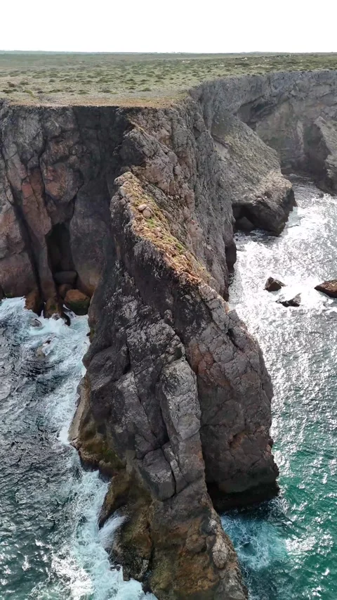 Aerial perspective of the dramatic Sagres coastline in Portugal with rugged Stock Footage 325221068