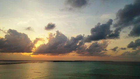 Aerial perspective of a dramatic sky during sunset above the calm Stock Footage 110849923