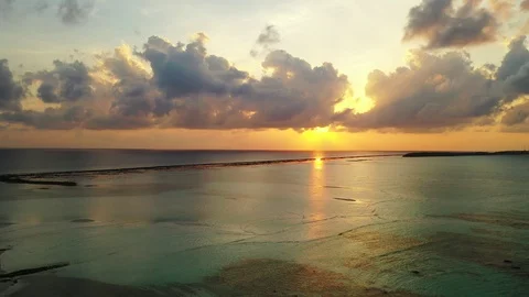 Aerial perspective of a dramatic sunset above the turquoise Caribbean Sea. Stock Footage 110849651