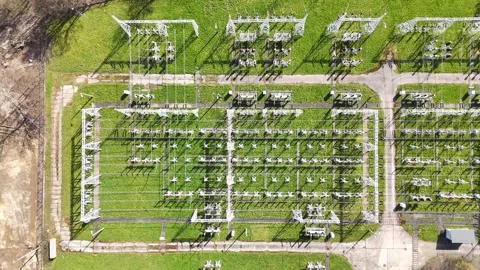 Aerial perspective of an electrical substation featuring power lines and Stock Footage 335876266