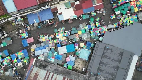 Aerial perspective emphasizing atmospheric appeal of morning Pudu market Stock Footage 259558936