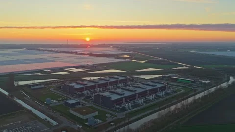 Aerial perspective of a large, modern data center facility in the dutch Stock-Footage 332680842