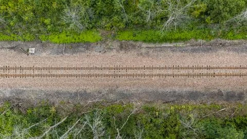 An aerial perspective looking straight down at a railroad track. Stock Photos