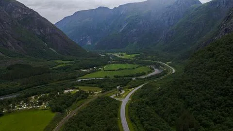 Aerial perspective of Rauma valley floor showing winding river, highway, rail Stock Photos