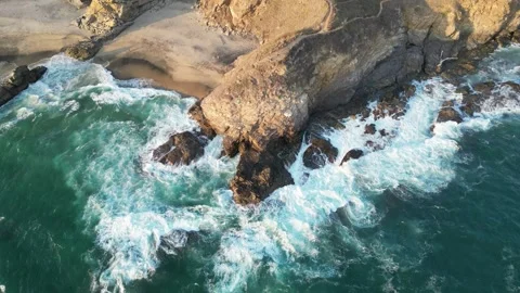 Aerial Perspective of Rolling Waves Breaking Along a Curved Coastline Mazunte Me Stock Footage 321707688