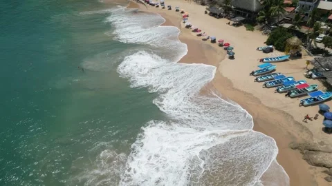 Aerial Perspective of Rolling Waves Breaking Along a Curved Coastline Mazunte Me Stock Footage 321707757