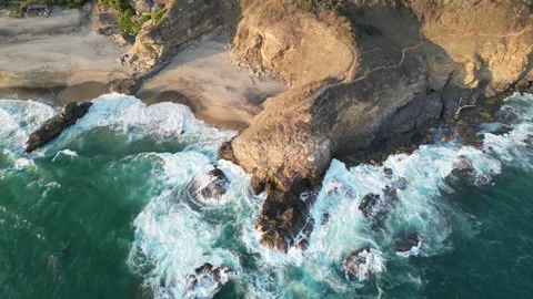 Aerial Perspective of Rolling Waves Breaking Along a Curved Coastline Mazunte Me Stock Footage 321707863