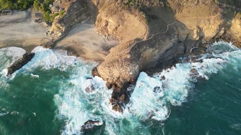 Aerial Perspective of Rolling Waves Breaking Along a Curved Coastline Mazunte Me Stock Footage 321707876