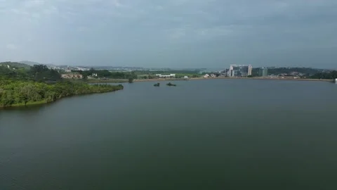 Aerial Perspective of Serene Waters Bordering Lush Shorelines and Developin.. Stock Footage 326183662