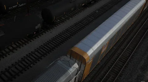 Aerial perspective shot of a freight train passing by downtown Los Angeles Stock Footage 59583407