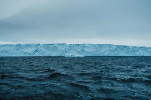 An aerial perspective showcases the dramatic melting icebergs of Antarctica Stock Photos