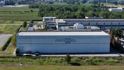 An aerial perspective showcases the expansive MicroData Group facility with.. Stockfoto's
