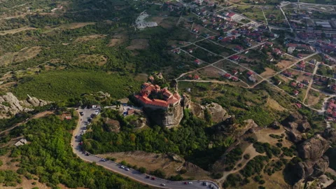 Aerial perspective showcasing the Monastery of Rousanou, dramatically situated Stock Footage 302093211