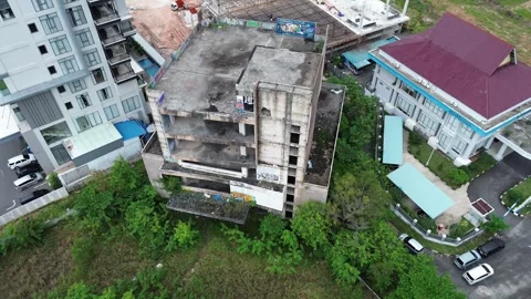 Aerial perspective showcasing urban development, derelict structures 動画素材 319607859