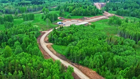Aerial perspective showing the development of a wind turbine farm with new Stock Footage 341384012