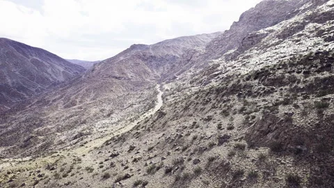 Aerial perspective showing isolated valleys and barren hills Stock Footage 343618967