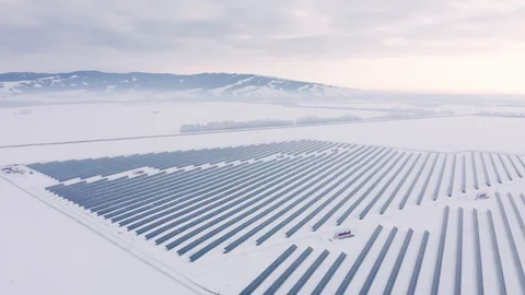Aerial perspective Solar panel farm Green Energy at winter snow sunny day Stock Footage 128630994