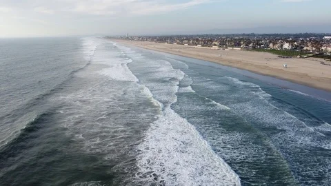 Aerial perspective of the Southern California coast near Huntington Beach Stock Footage