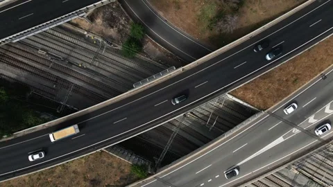 Aerial perspective of a sprawling road junction bustling with traffic Stock Footage 294263615