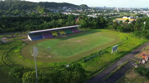 Aerial perspective of a verdant athletic stadium nestled within a vibrant s.. Stock Footage 325277431