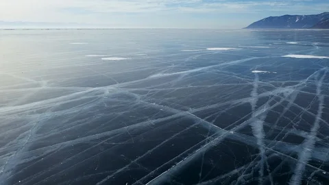 Aerial Perspective View of Beautiful Deep Blue Ice Textured Frozen Baikal Lake Stock Footage 106616527