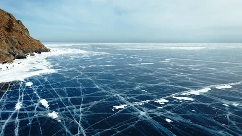Aerial Perspective View of Beautiful Deep Blue Ice Textured Frozen Baikal Lake Video stock 106649351