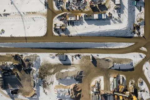 Aerial Photo Busy Industrial Construction Site. Aerial View of an excavator,  Stock Photos