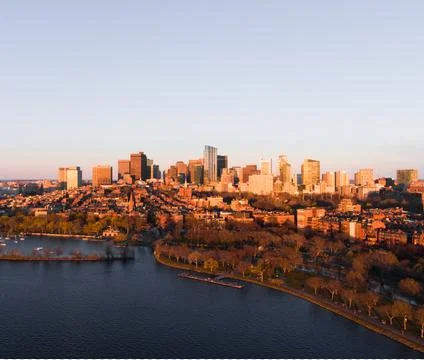 Aerial Photo of Downtown Boston at Sunset Golden Hour over Charles River Stock Photos