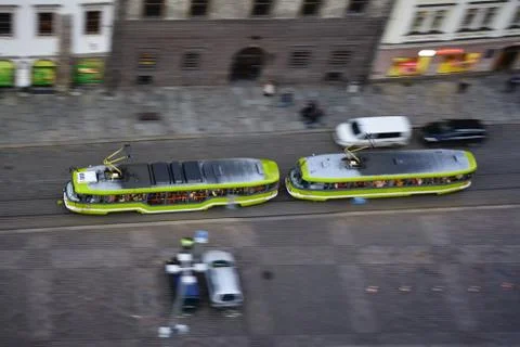 Aerial photo of a green tram going fast down the street Stock Photos