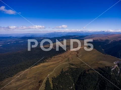 Aerial photo of wild mountain terrain. Russia. Stock Photos
