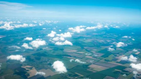Aerial photograph of a pattern of fields, valleys and villages with cloud sky Stock Photos