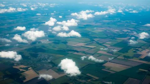 Aerial photograph of a pattern of fields, valleys and villages with cloud sky Stock Photos