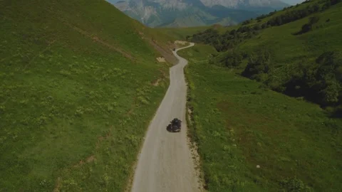 Aerial photography of a car in the mountains Stock Footage 327989341