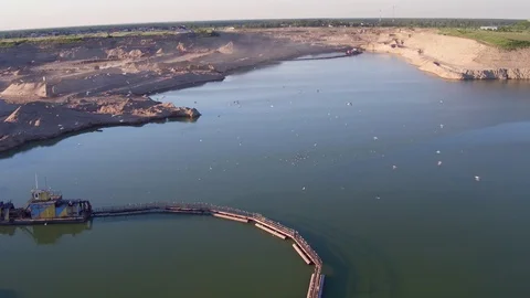 Aerial photography of the development of a sand pit. Lake on a sand pit. Lake Stock Footage 104104518