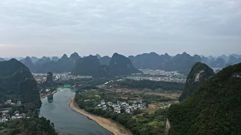 Aerial Photography of Distant View of Deep Li River Valley Town and Peak Forest Video stock 337155569