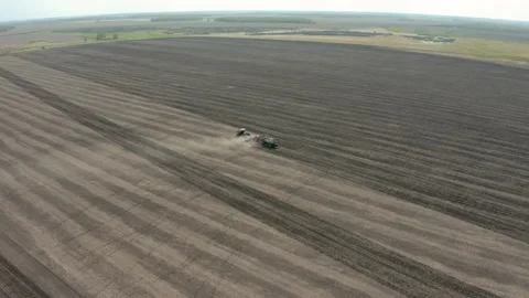 Aerial photography of the processing of fields with a sowing complex in spri Stock Footage 151496148