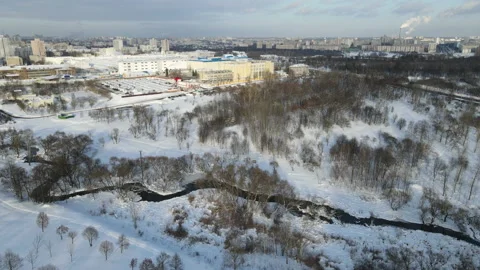 Aerial photography of the winter park. Snow covered earth. The river is runni Stock Footage 148093553