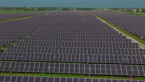 Aerial Photovoltaic Solar Array Converting Sunlight to Electricity in Field Stock Footage 346549277