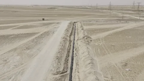 Aerial Pipeline Infrastructure Construction Corridor Across Desert Terrain Stock Footage 344824208