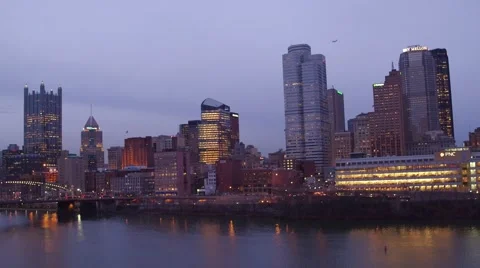 Aerial of Pittsburgh from the Mon River at dusk Stock Footage 59382450