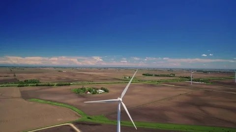 Aerial Pivot Around Electric Windmill Over Farmland Stock Footage 76134094