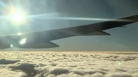 Aerial plane wing clouds in the air sun flare Vidéo 221593466