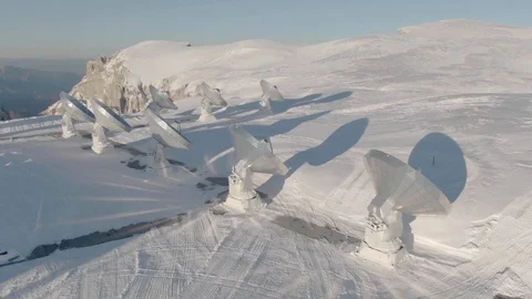 Aerial of Plateau de Bure Interferometer on snowy hill in the French Alps Video stock 119124040